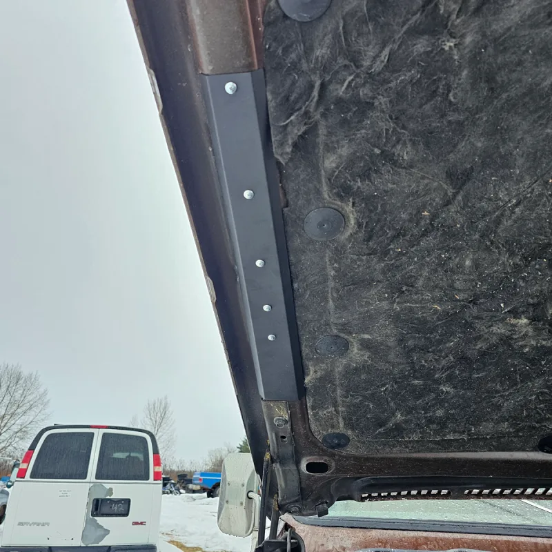 Hood braces shown installed on a 73-80 Chevy squarebody truck hood