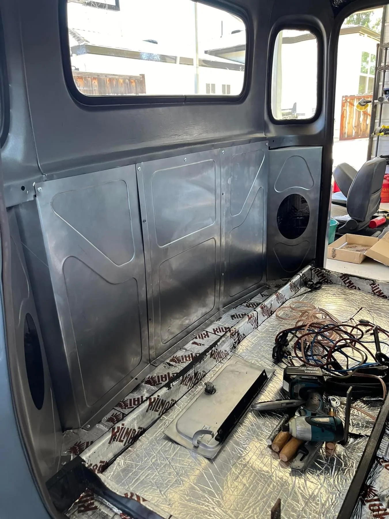 Bead rolled behind the seat panels and speaker brackets, alternate angle