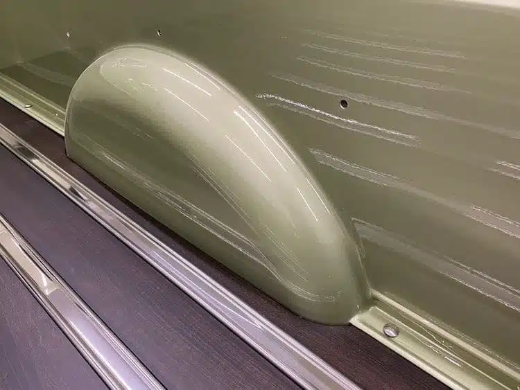 Custom wheel tubs installed in vintage Chevy square body truck