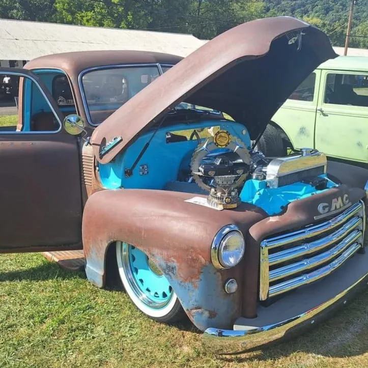 Hood strut kit shown installed on a 1947-1954 Chevy truck hood