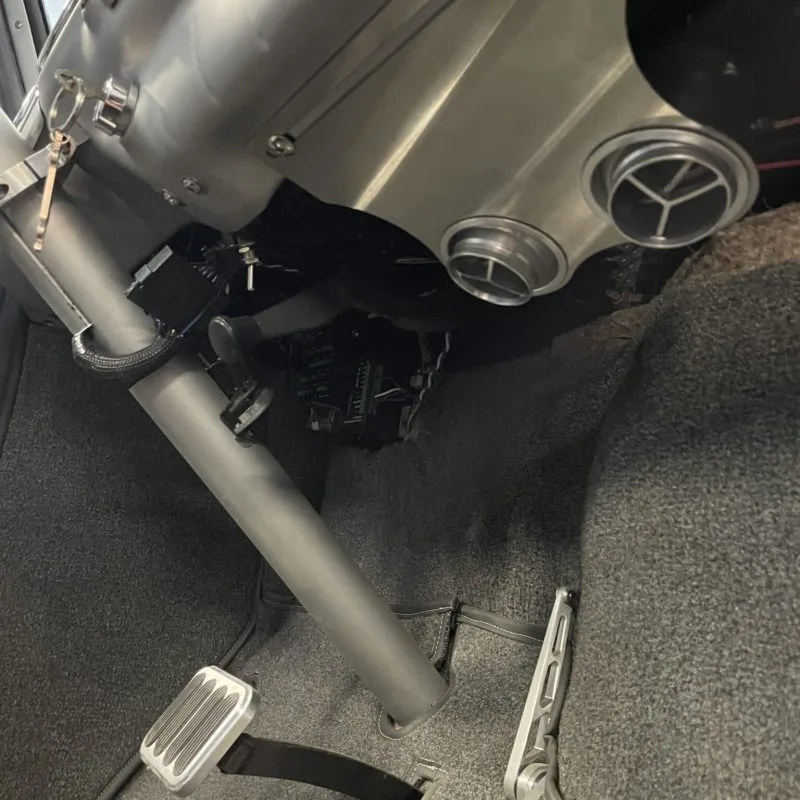 Under dash AC vent bracket mounted in a 47-53 GMC Chevy truck cab