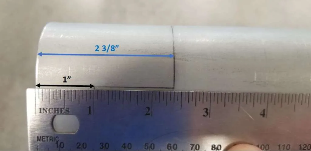Measuring 1 inch and 2 3/8 inch reference lines from rear of bed face
