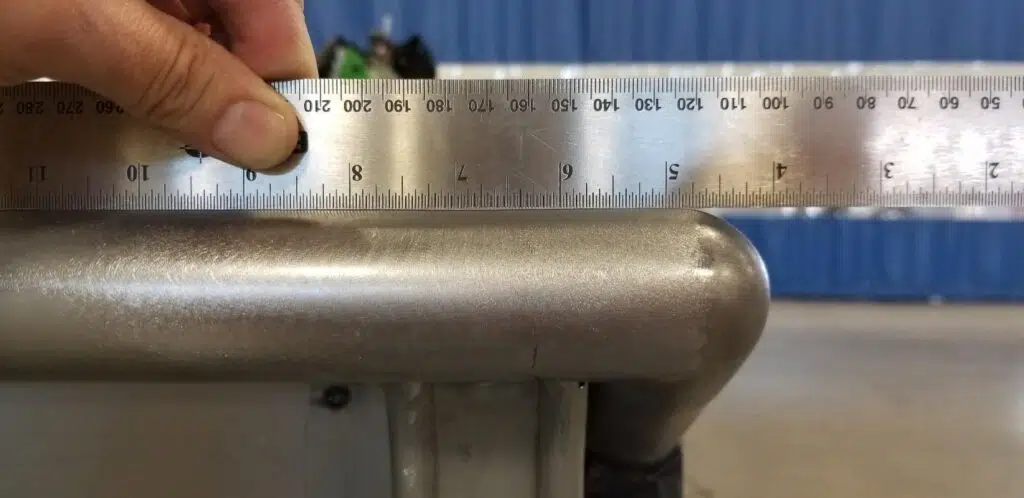 Straight edge ruler check on ground bed rail