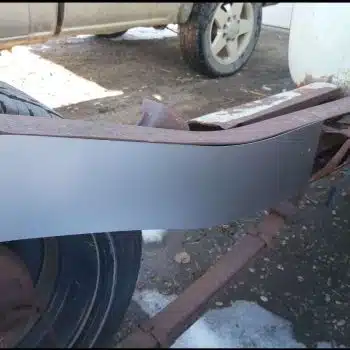 Rear frame boxing plate welded to a GMC Chevy truck frame rail, close-up