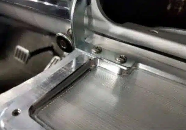 Speaker grille finger-tight with nuts threaded on