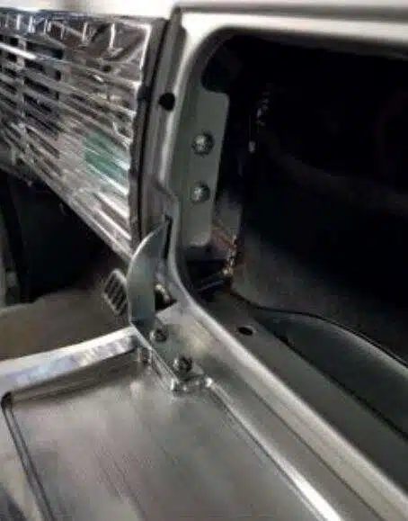 Aligning speaker grille level with glove box door
