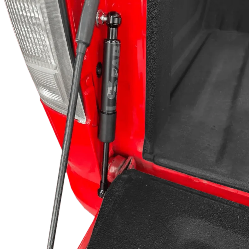 Tailgate saver shock shown installed on an 88-98 GMC Chevy OBS truck