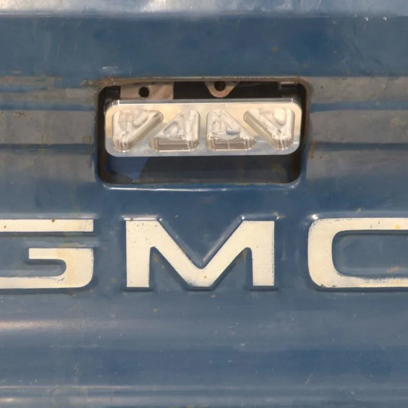 Tailgate release handle shown installed on a 73-80 GMC Chevy truck tailgate