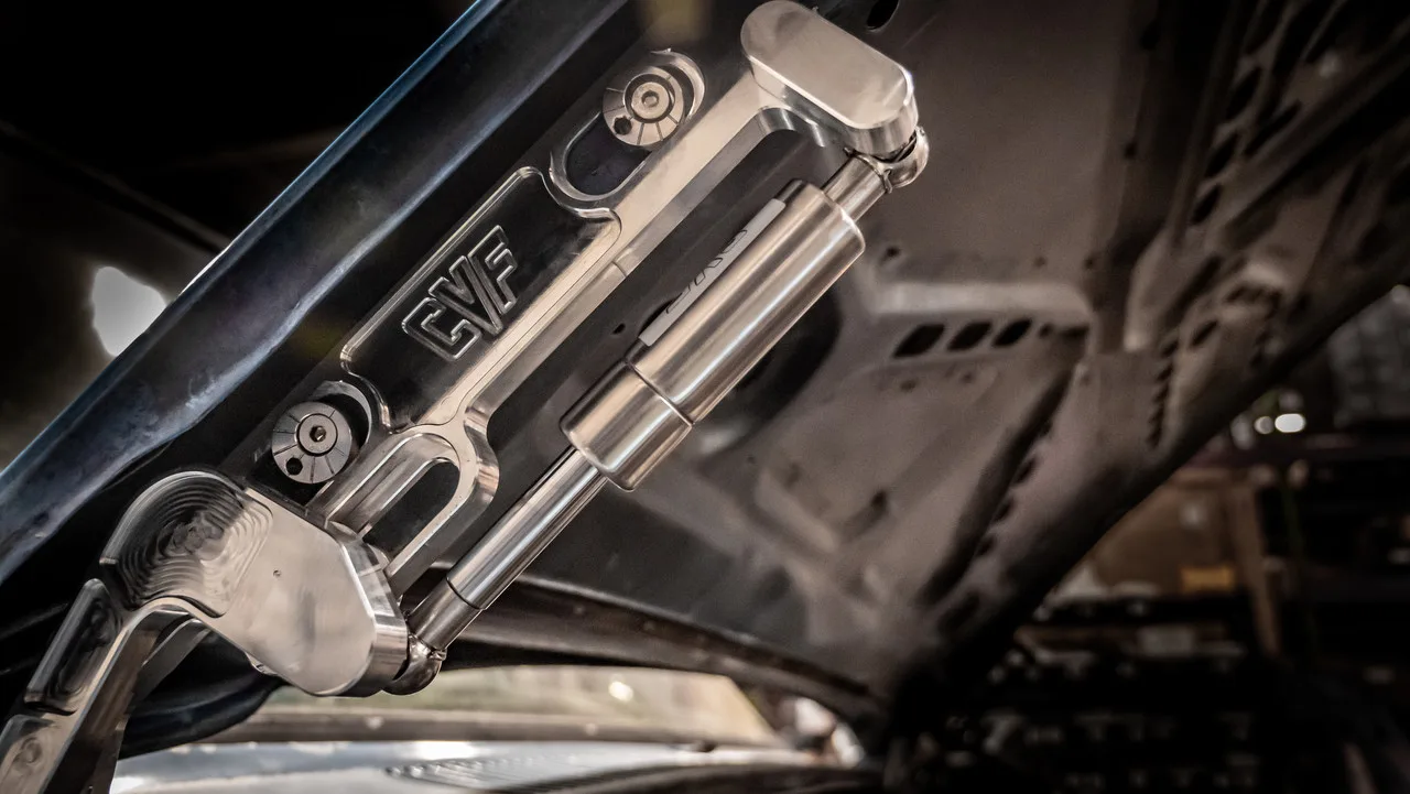 Billet hood hinges shown installed on an 81-87 Chevy GMC C10 truck