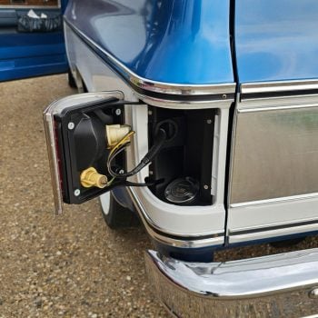 installed chevy taillight fuel filler on a square body truck open