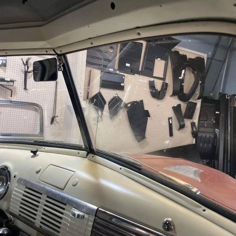 Interior windshield garnish molding shown installed in a 47-53 Chevy truck cab