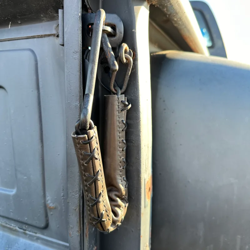 Tailgate chain covers on a classic truck tailgate, close-up detail