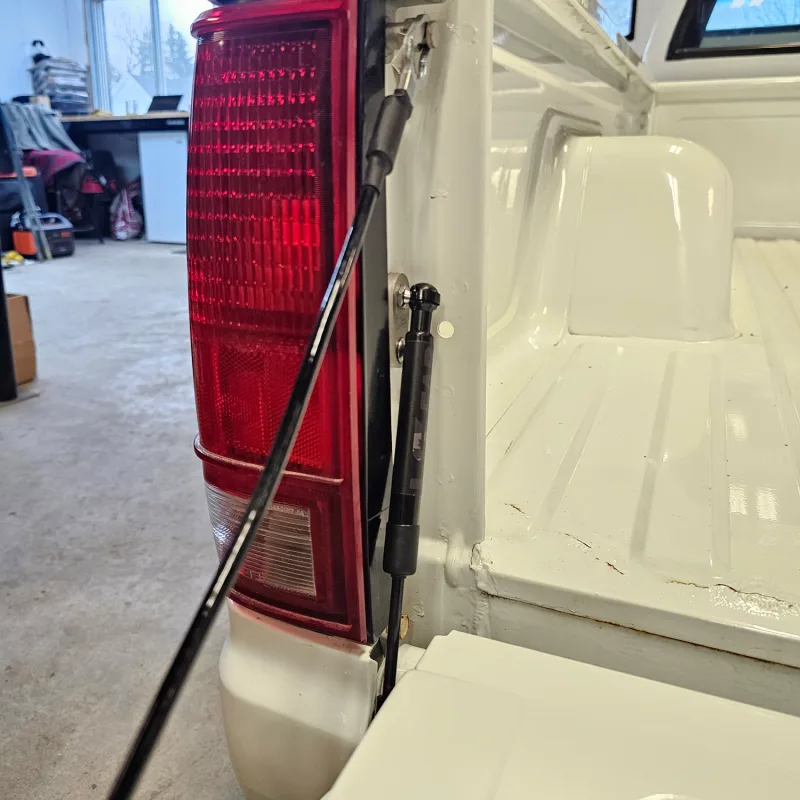 Tailgate saver shock for 82-93 Chevy GMC S10 truck, close-up detail