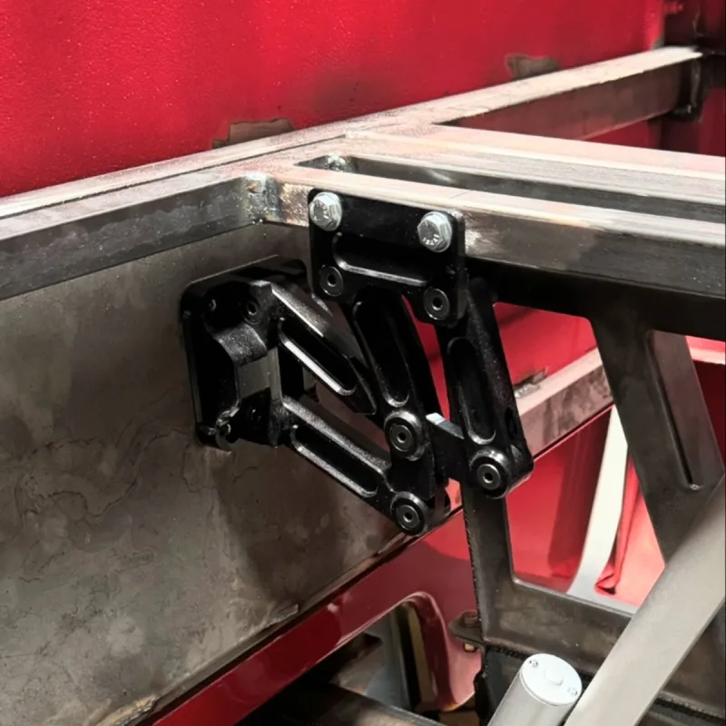 Billet aluminum tilt bed scissor hinge shown installed on the truck