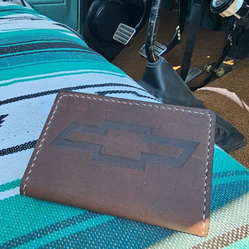 Leather truck registration holder, embossed logo close-up