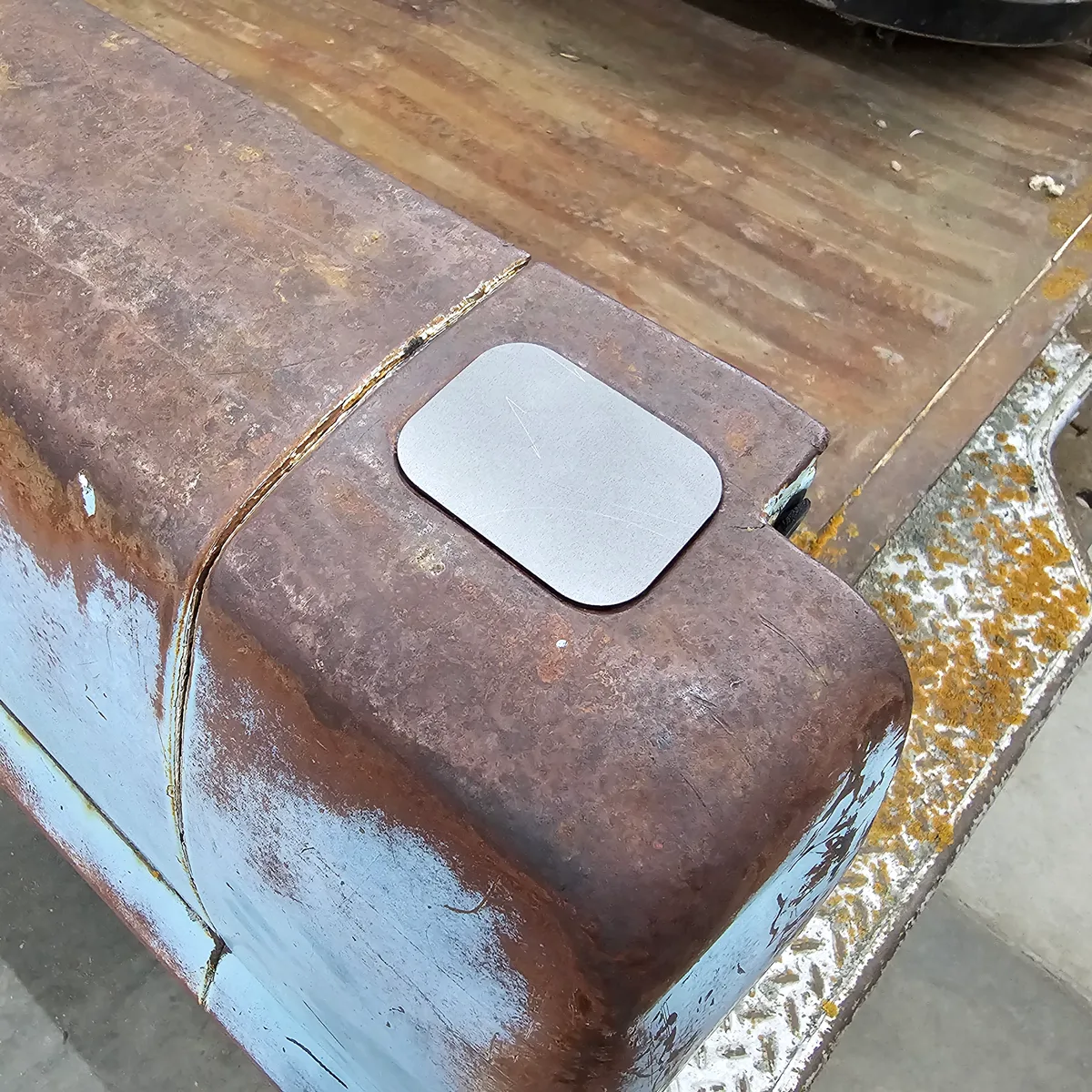 Stake pocket delete shown installed on a 67-72 Ford truck bed rail
