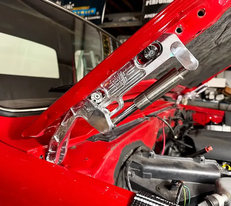 Billet aluminum adjustable hood hinges installed on a classic Chevy truck