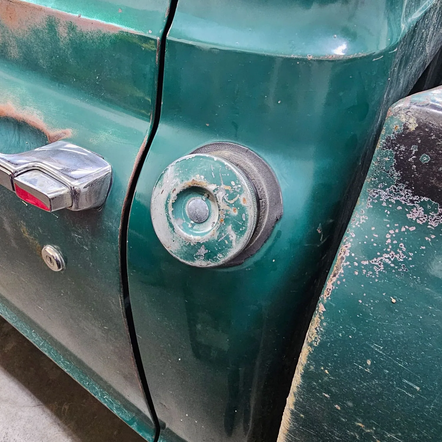 Trickle charge adapter built into a fuel filler relocation kit