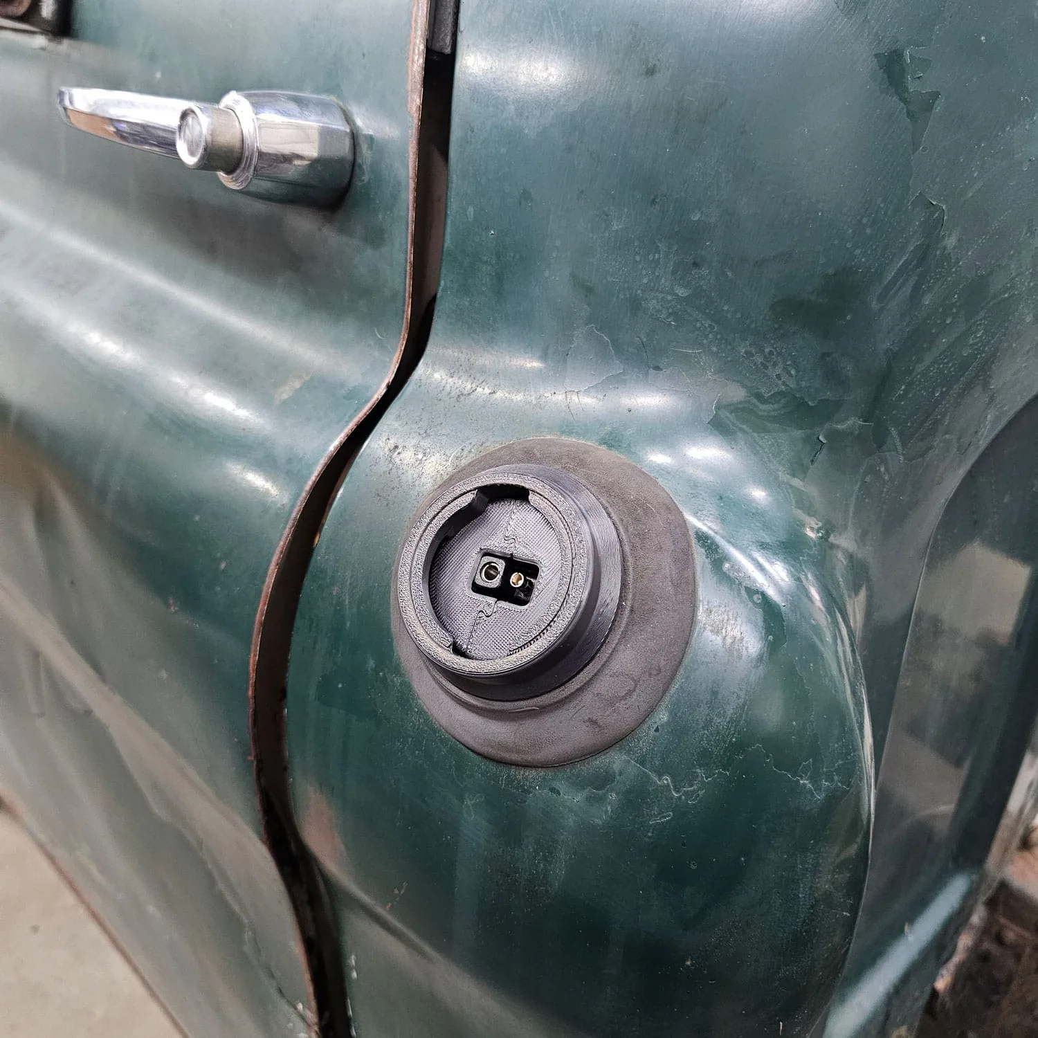 Trickle charge adapter for a hidden fuel filler relocation kit, detail