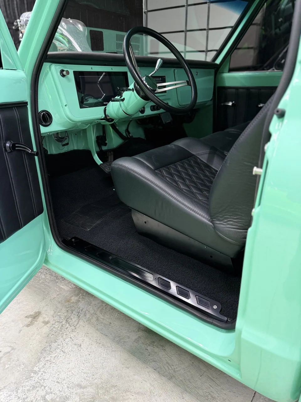 Billet sill plates shown installed in a 70 C10 truck door opening