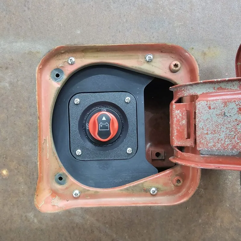 Charger port housing that replaces the factory fuel filler on a 77-91 GMC Chevy truck